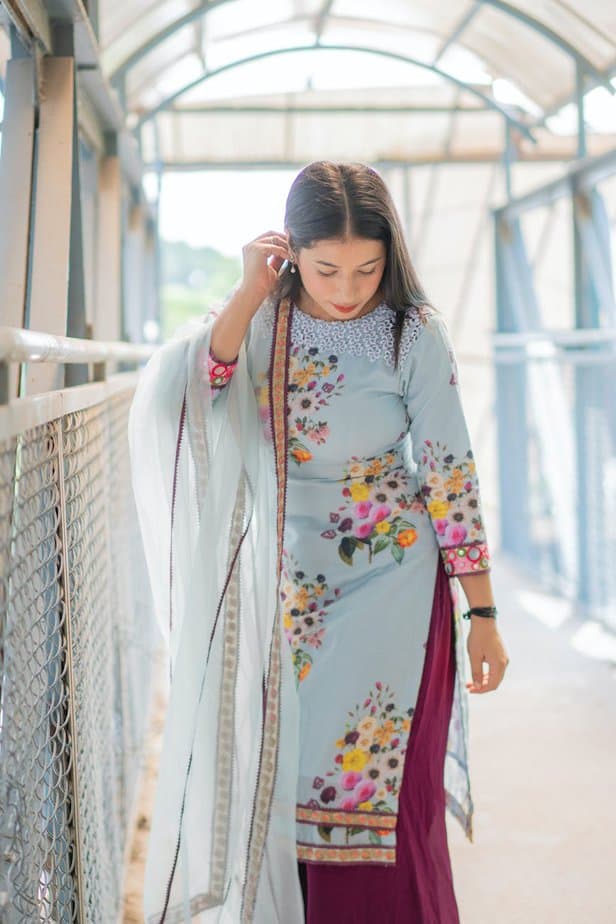 a woman in blue floral dress